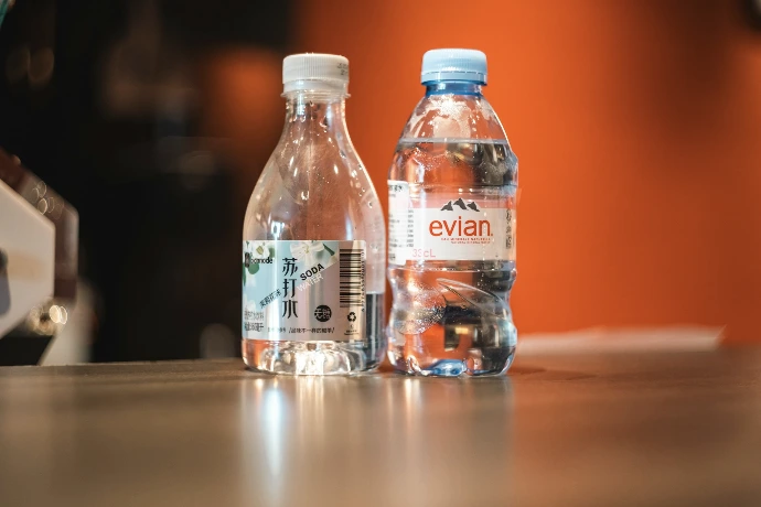 Two bottles of water on a table